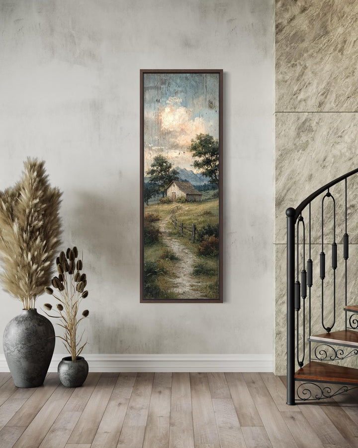Tall narrow rustic barn landscape wall art with a winding country path in a dark wood frame.