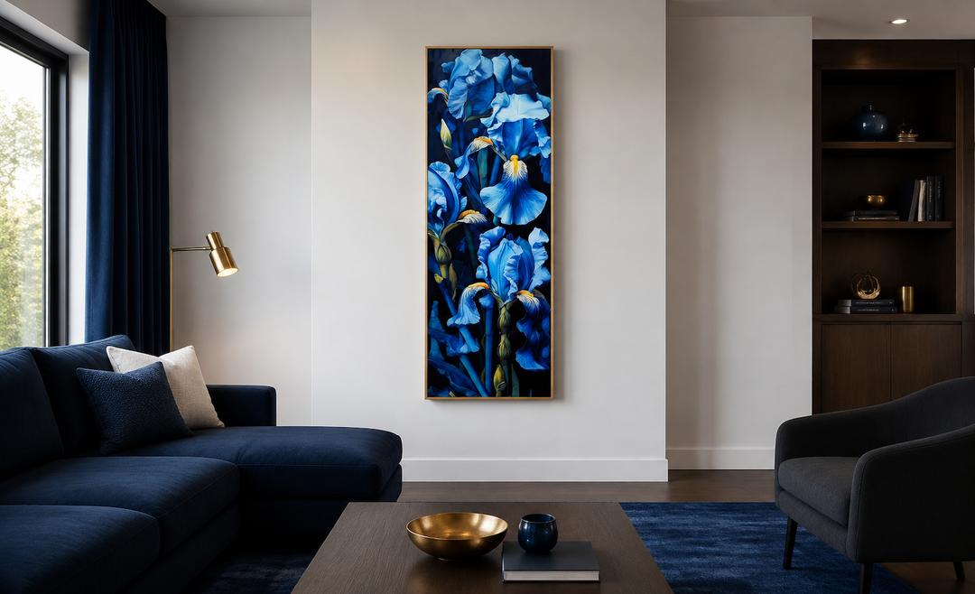 Vertical framed canvas art of tall blue irises on a black background in a modern living room.