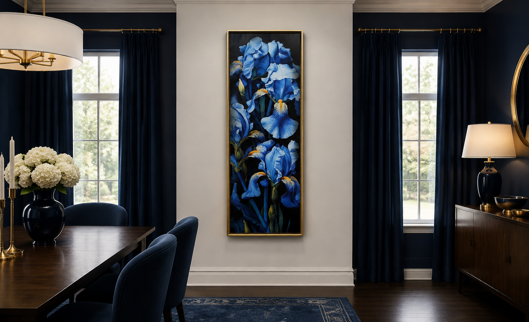 Tall narrow framed canvas wall art featuring blue irises on a black background in a dining room.