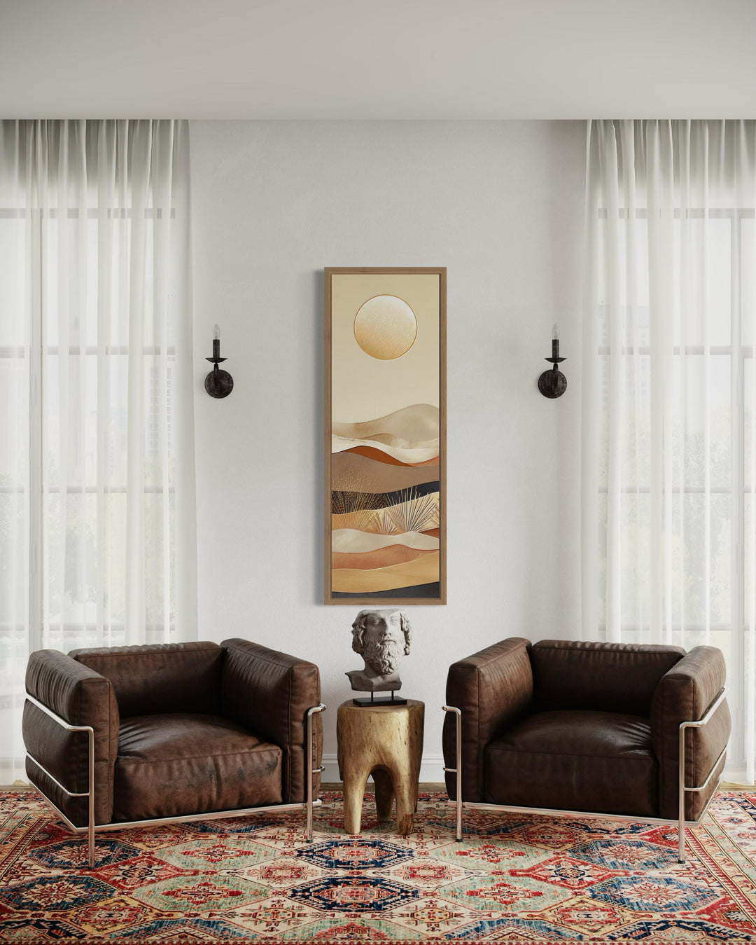 Tall narrow boho canvas art featuring a sun over desert dunes in earthy tones on a white wall.