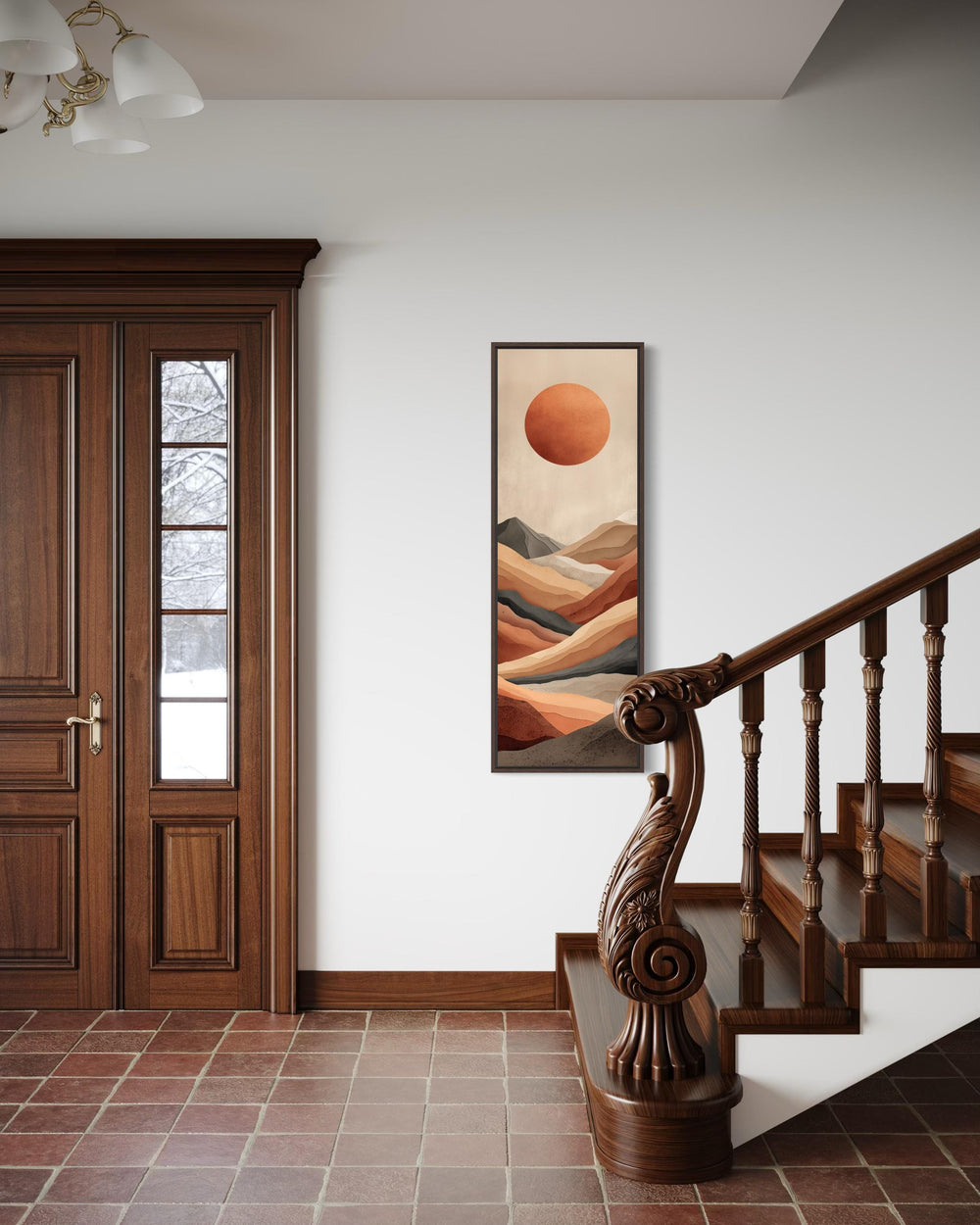 Tall narrow vertical canvas print of a terracotta desert landscape with a sun on a white wall.