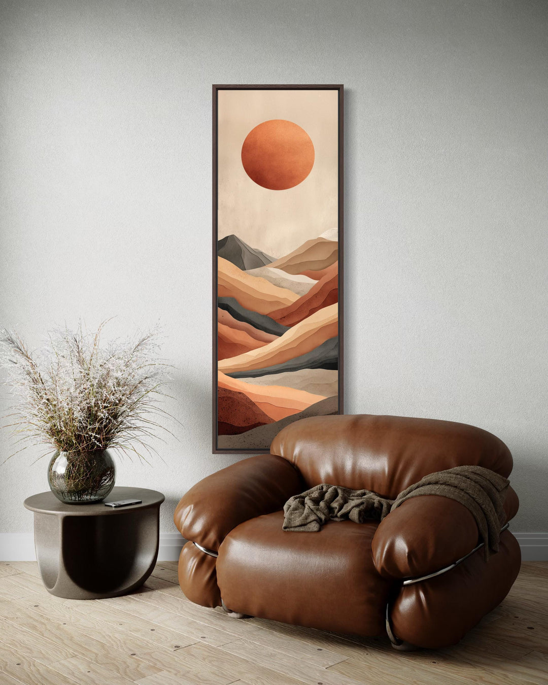 Tall narrow vertical canvas print of a terracotta desert landscape with a sun and mountains.