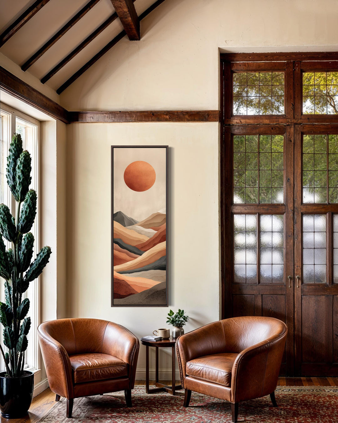 Tall narrow vertical canvas print of a terracotta desert landscape with a sun and modern mountains.