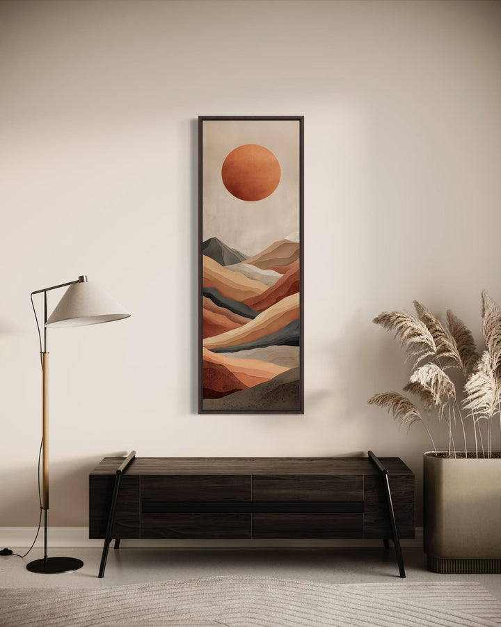 Vertical canvas print of a terracotta desert landscape with a sun above a modern mountain horizon.