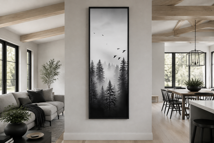 Tall narrow vertical framed canvas wall art featuring a black and white foggy forest with birds.
