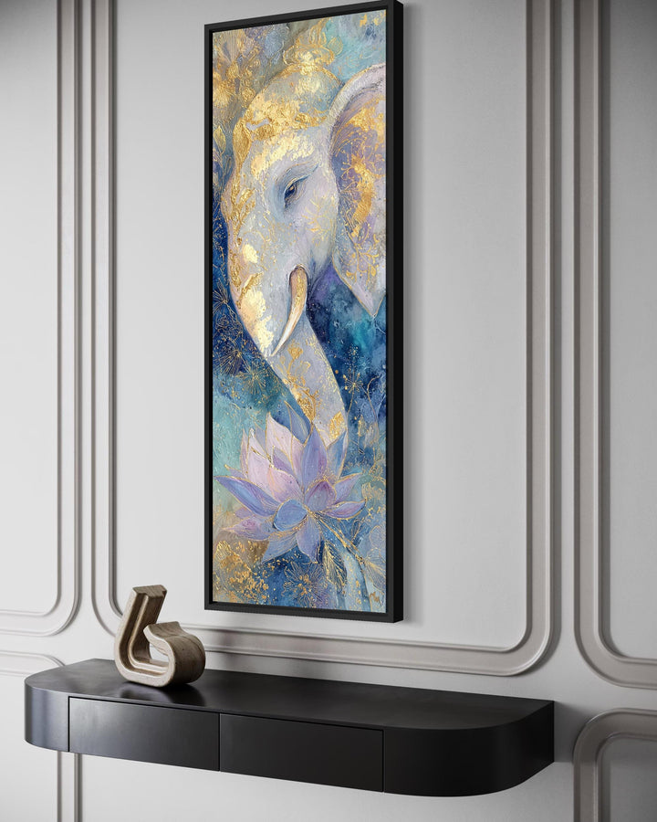 Tall narrow Ganesh wall art featuring a blue and gold elephant and lotus in a black frame.