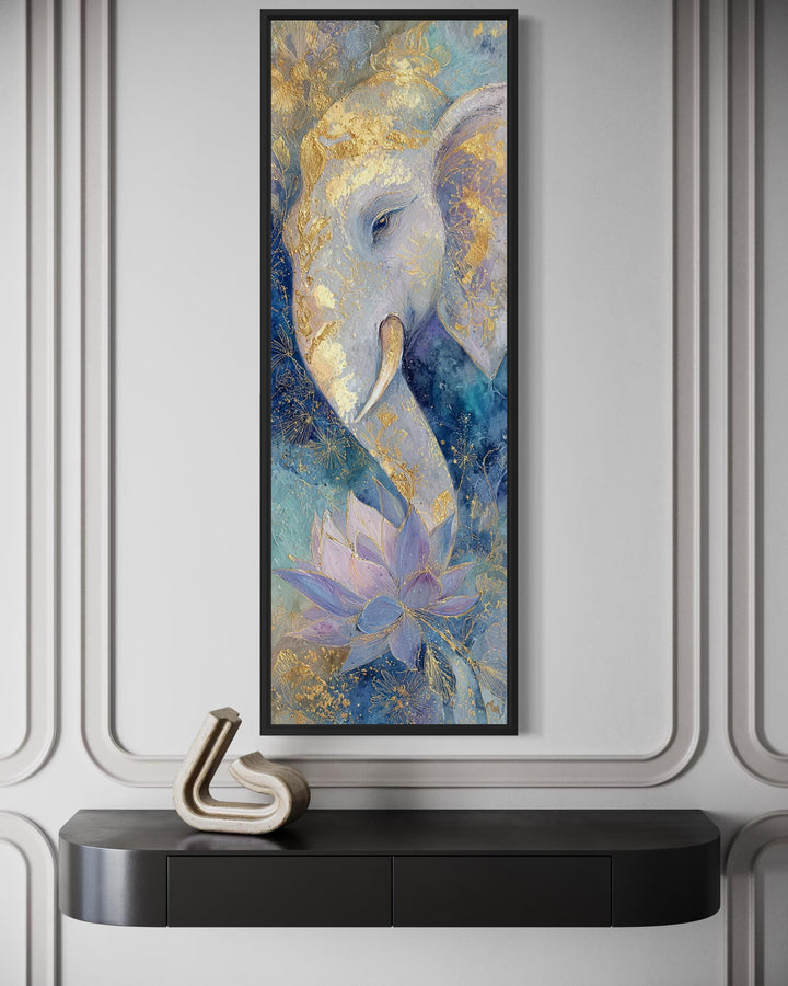 Tall narrow Ganesh wall art featuring a blue and gold elephant and lotus in a black frame.