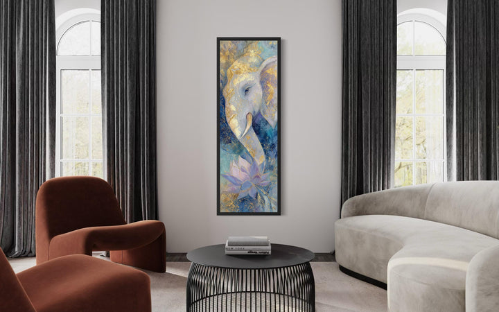 Tall narrow blue and gold Ganesh wall art with a lotus flower in a modern living room setting.