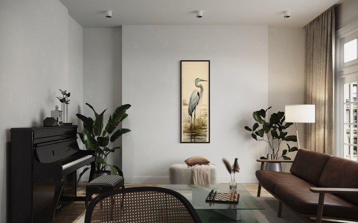 Tall narrow vertical framed canvas wall art featuring a great egret in a serene coastal setting.