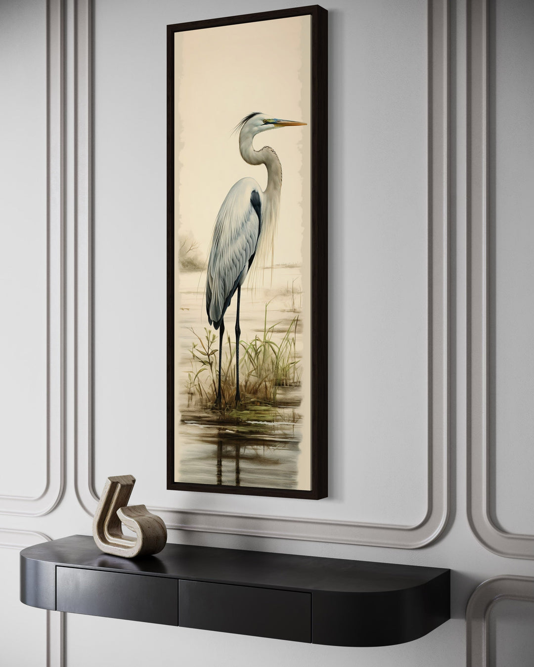 Tall narrow framed canvas wall art featuring a great egret in a coastal landscape above a console.