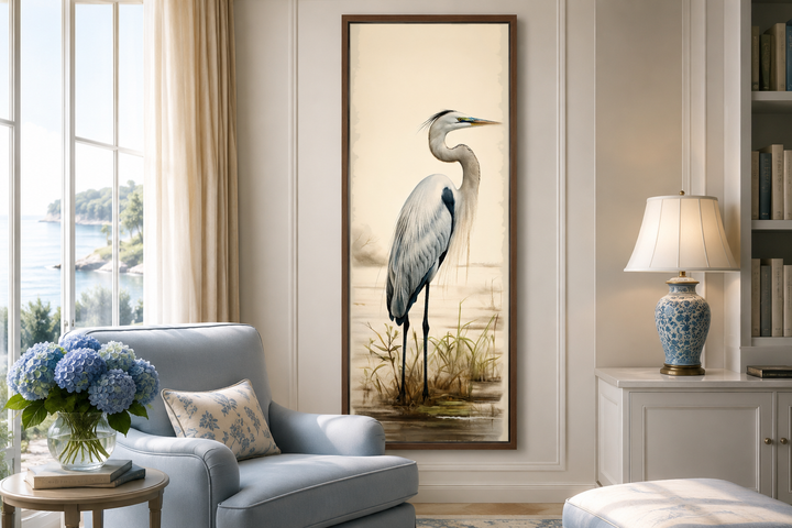 Tall narrow framed canvas wall art featuring a watercolor-style great egret in a coastal room.