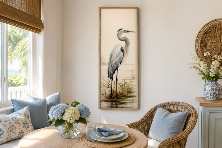 Tall narrow framed canvas wall art featuring a graceful great egret in a coastal setting.