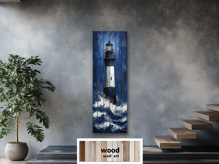 Vertical distressed wood wall art featuring a tall lighthouse amidst crashing ocean waves.