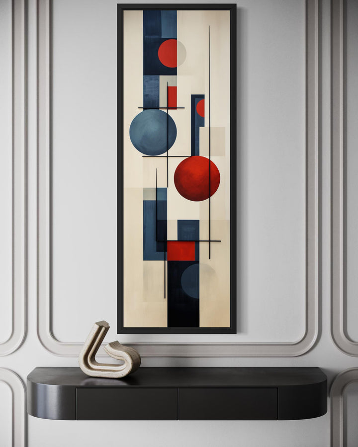 Tall narrow mid-century modern geometric wall art with abstract red and blue circles and lines.