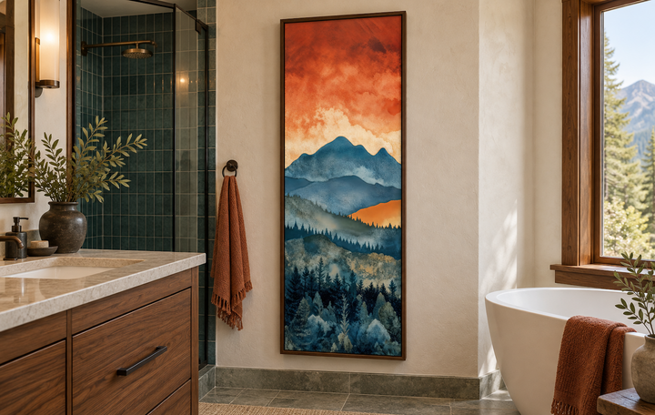 Tall narrow vertical canvas art of a mountain forest landscape at sunset in a modern bathroom.