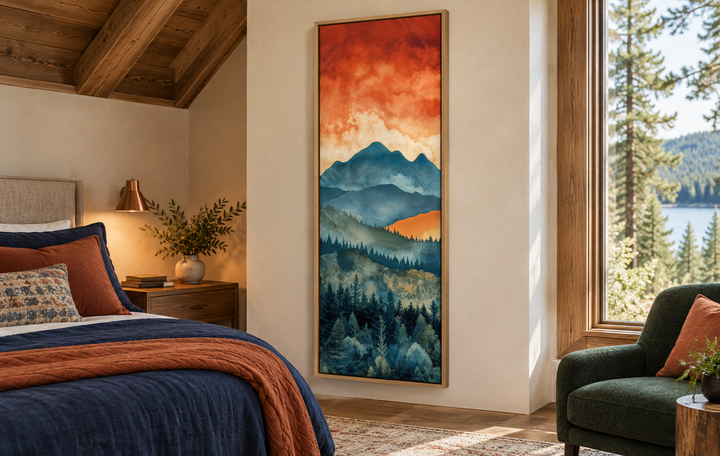 Vertical canvas wall art of a mountain forest landscape under a vibrant orange sunset in a bedroom.