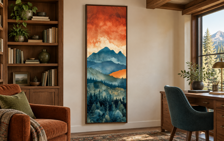 Tall narrow vertical canvas wall art featuring a blue mountain forest under an orange sunset sky.