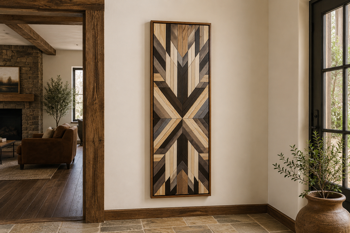 Tall narrow vertical framed canvas wall art with neutral brown Aztec-inspired geometric patterns.