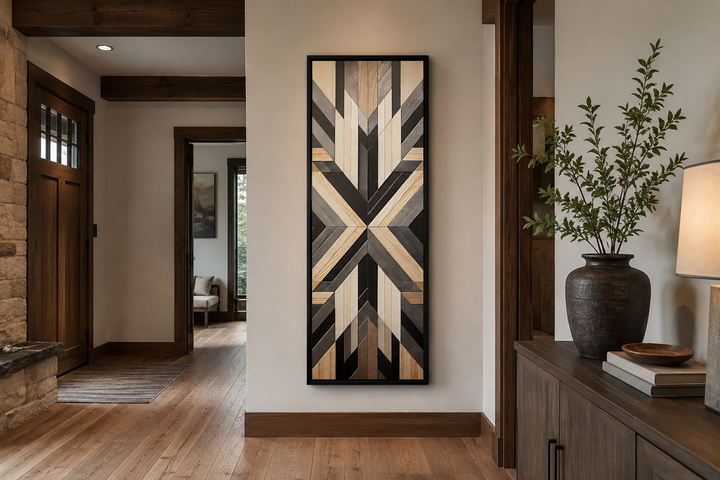 Tall narrow vertical wall art with neutral brown Aztec geometric patterns in a black frame.