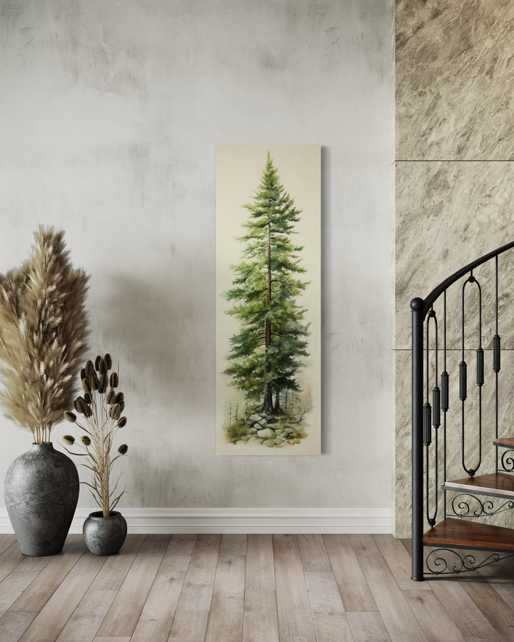 Tall narrow pine tree vertical framed canvas wall art hanging on a neutral wall in a modern room.