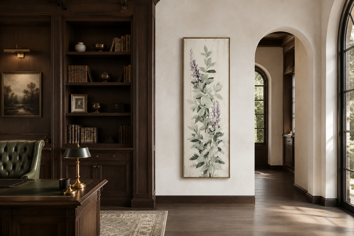 Tall narrow framed canvas wall art featuring sage green basil leaves and purple flowers.