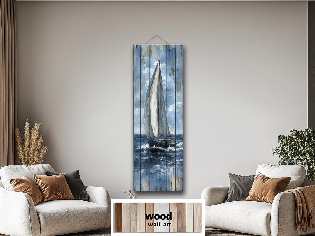 Tall narrow sailboat painting on distressed wood planks, featuring a nautical blue and white theme.