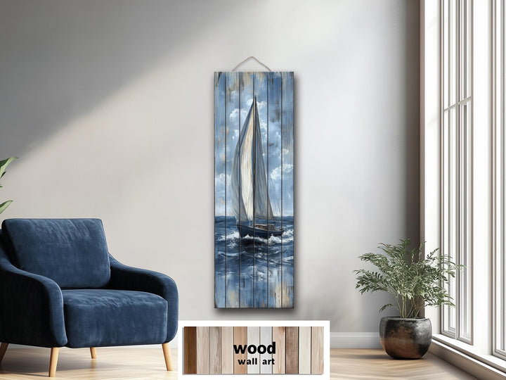 Tall narrow sailboat painting on distressed wood planks hanging in a modern living room.