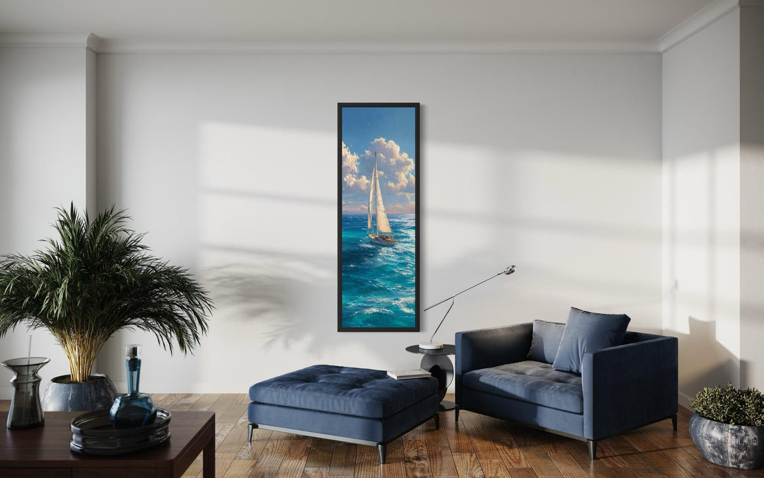 Tall narrow vertical canvas print of a sailboat on a deep blue ocean under a cloudy sky.