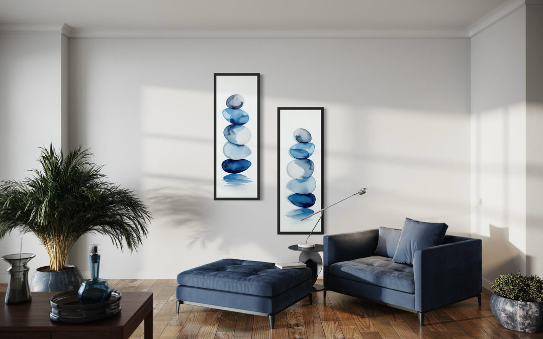 Two tall, narrow canvas prints featuring stacked blue watercolor zen stones on a white background.