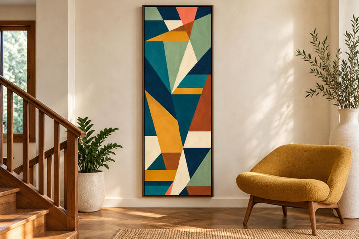 Tall narrow vertical mid-century modern geometric abstract canvas art in teal, ochre, and rust.