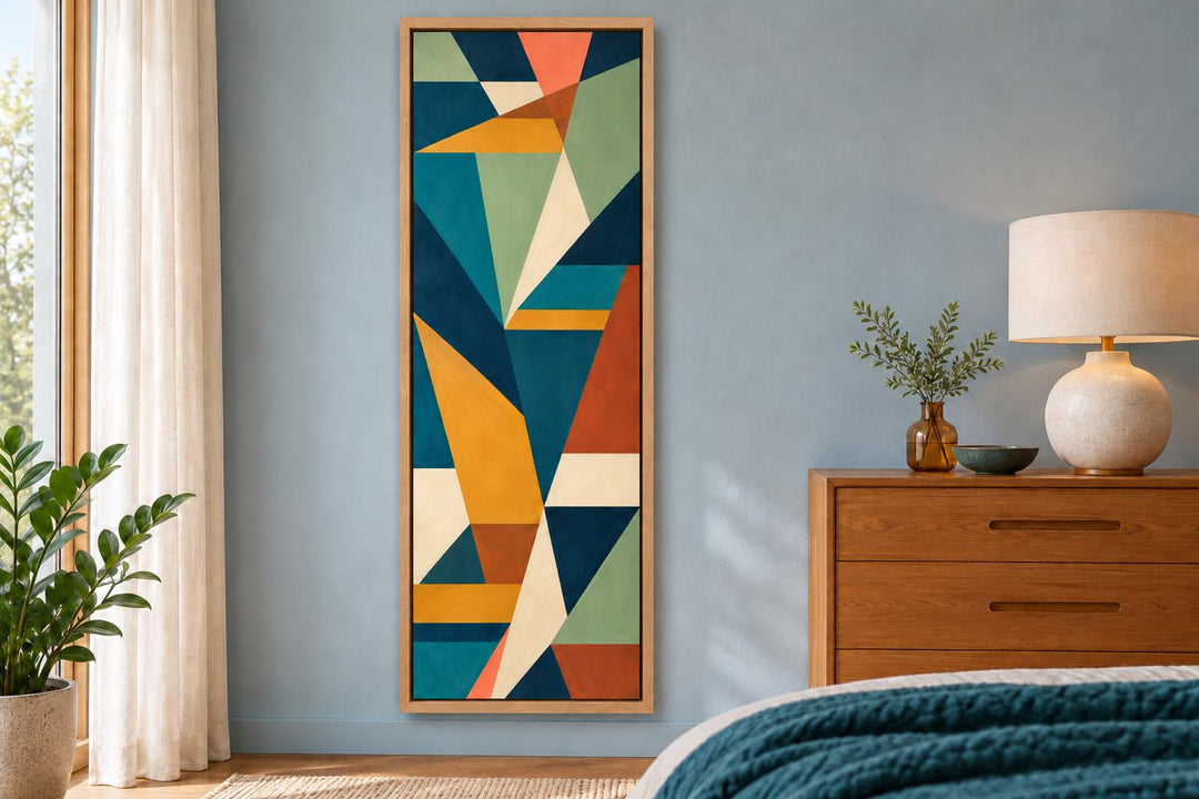Tall narrow vertical mid-century modern geometric abstract canvas wall art in a wood frame.