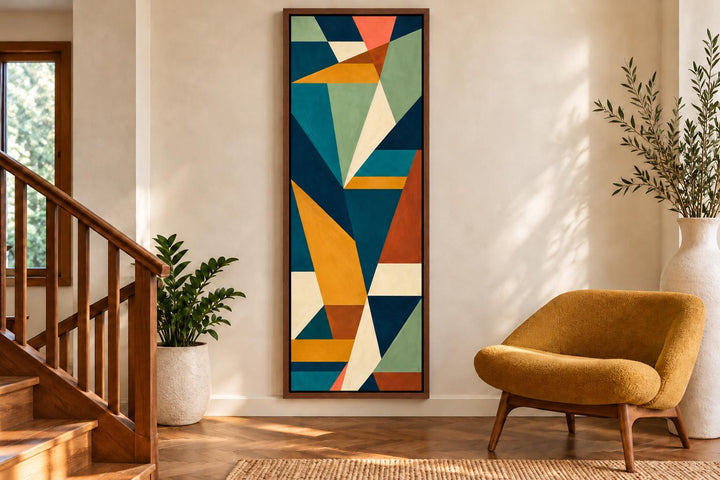 Tall narrow vertical mid-century modern geometric abstract canvas art in teal, ochre, and rust.