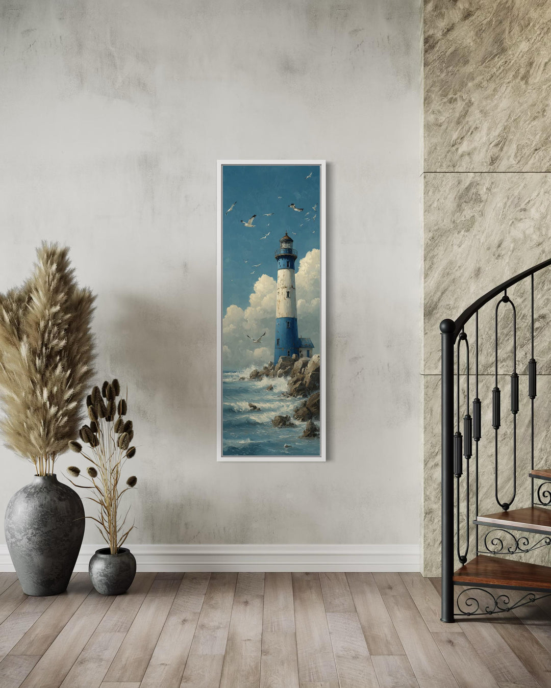 Tall slim lighthouse canvas wall art in a vertical narrow frame on a neutral wall by a staircase.