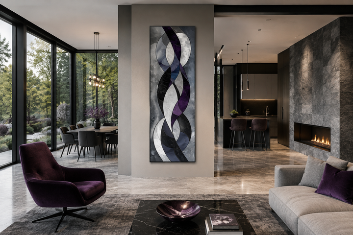 Tall vertical abstract canvas art with purple, lavender, and grey geometric shapes in a modern room.