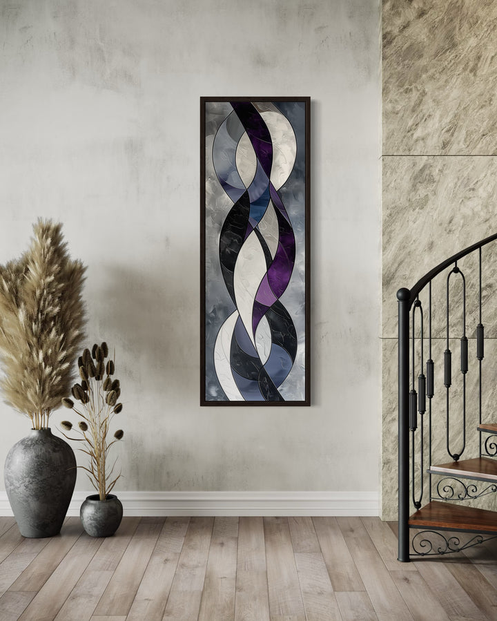 Tall thin vertical framed canvas wall art with purple, lavender, and grey geometric abstract shapes.