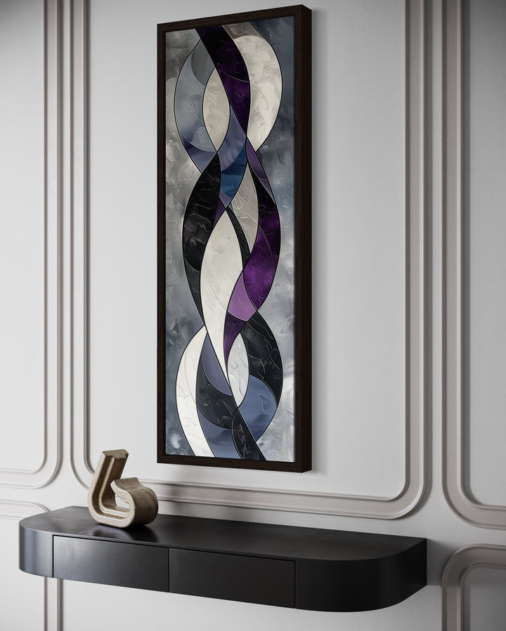 Tall vertical abstract canvas art with purple, grey, and black interlocking curves in a dark frame.