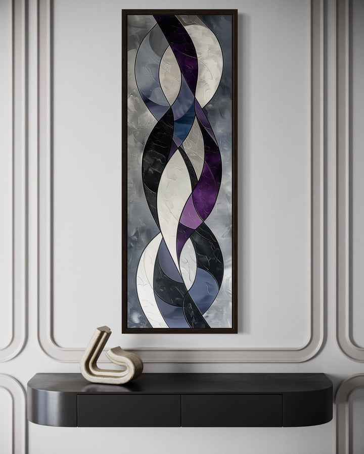 Tall vertical framed canvas art with abstract purple, grey, and white interlocking curved shapes.