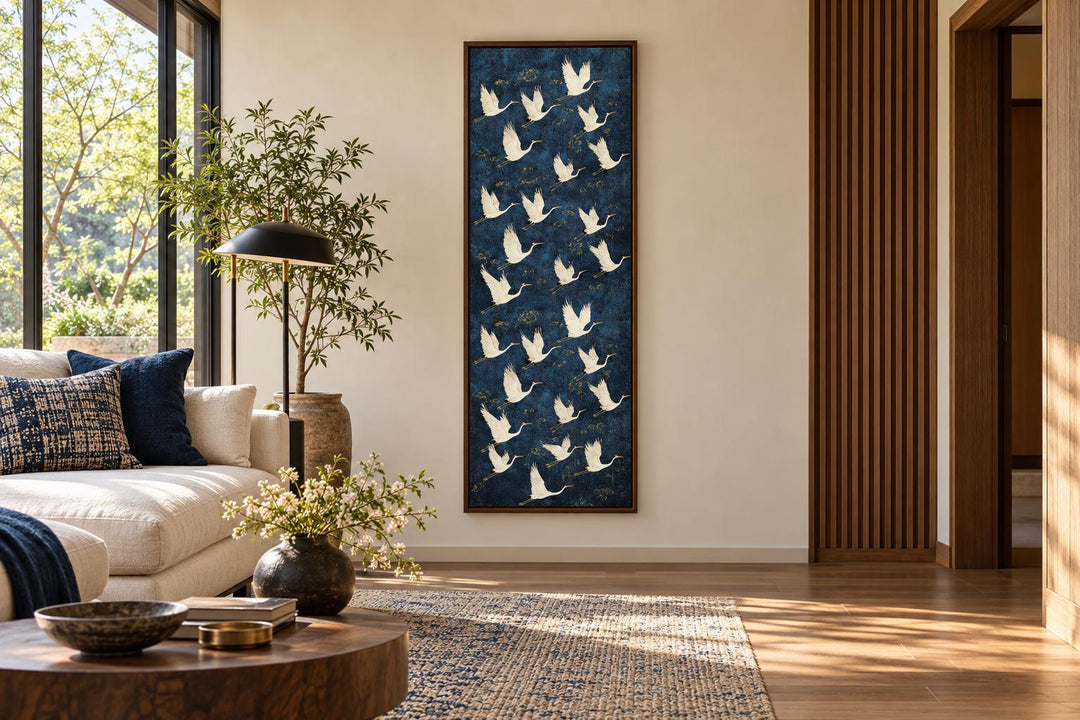 Tall vertical framed canvas wall art featuring white flying cranes on a deep navy background.