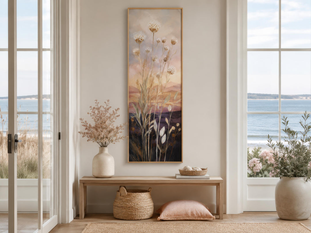 Tall vertical canvas art of wildflowers and grasses against a gold and purple sunset sky.