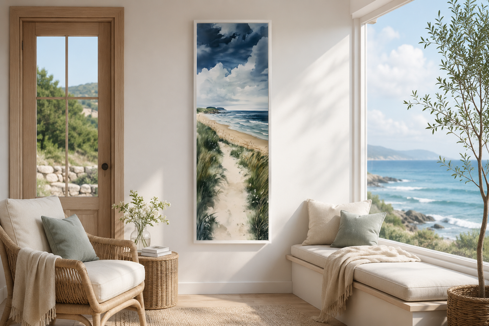 Tall narrow vertical framed canvas wall art of a coastal seashore with sand dunes and blue ocean.