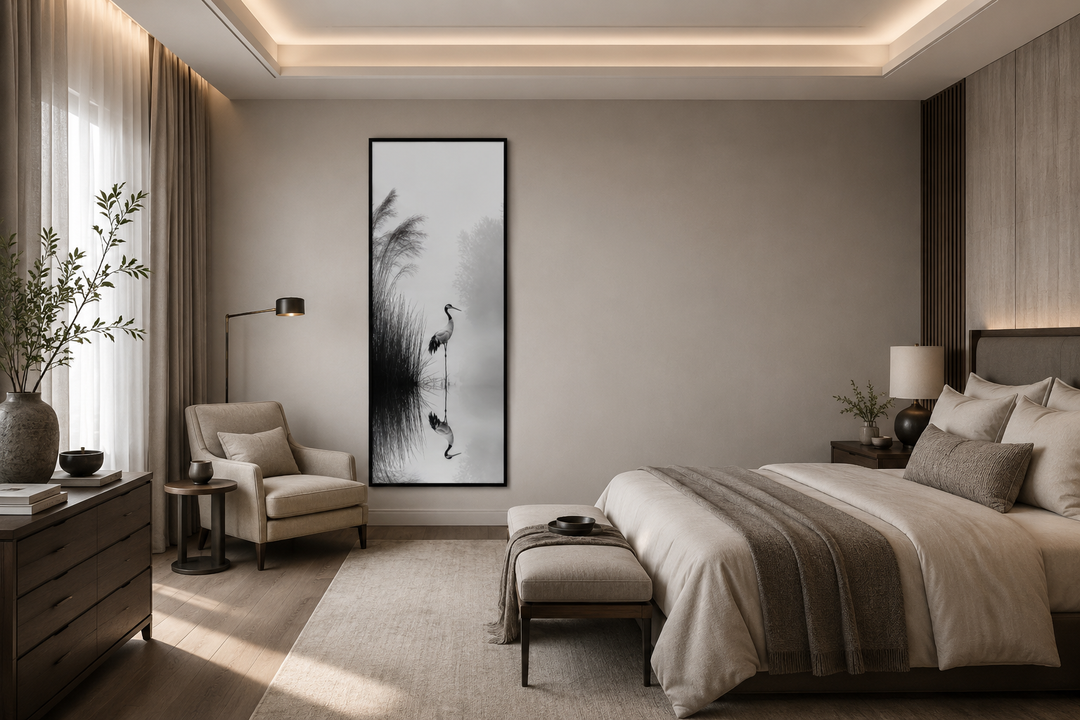 Tall narrow black and white Japanese crane wall art in a minimalist zen-style bedroom.