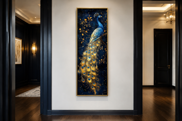Tall narrow framed canvas wall art of a blue and gold peacock on a dark navy background.