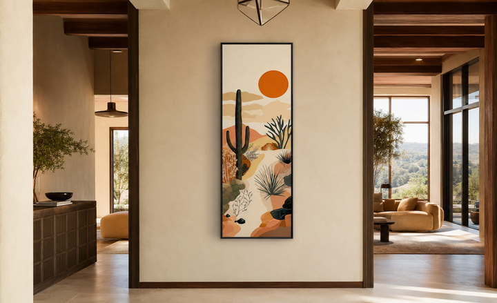 Tall narrow framed canvas wall art featuring a desert cactus landscape with a bold orange sun.