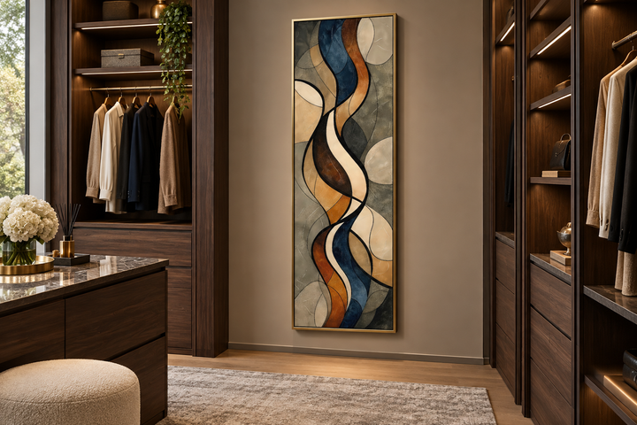 Tall narrow framed canvas wall art with abstract earth tones and flowing patterns in a walk-in closet