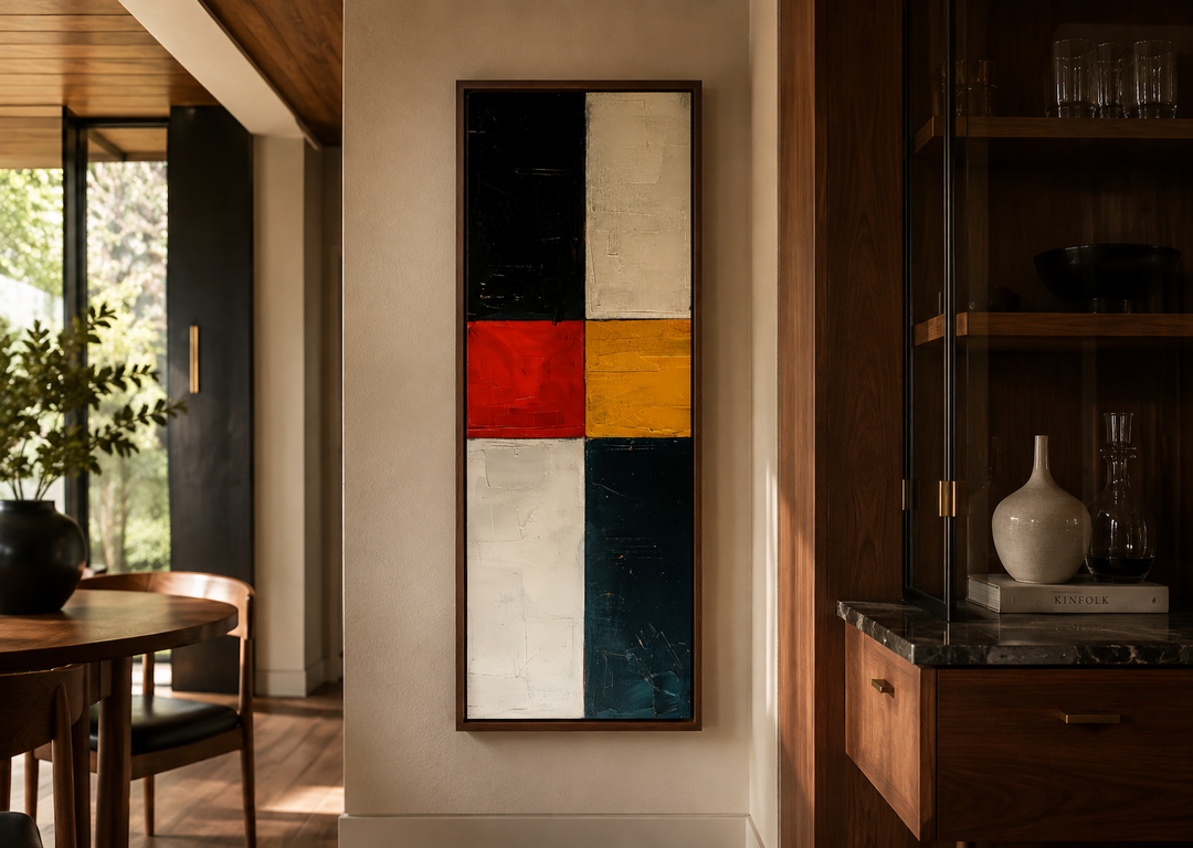Tall narrow vertical wall art with geometric blocks of black, white, red, yellow, and blue.