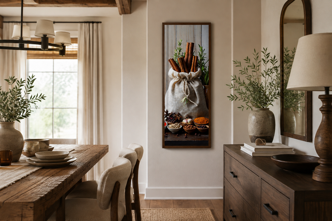 Tall narrow vertical framed canvas wall art of herbs and spices in a rustic kitchen setting.