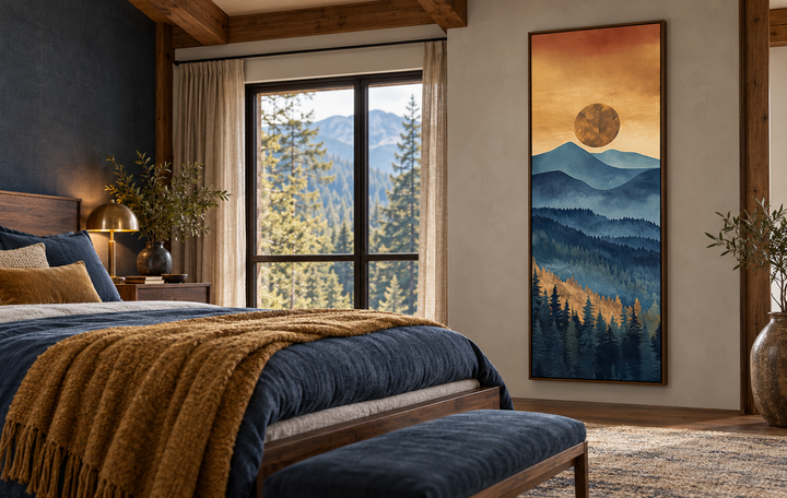 Tall narrow vertical canvas wall art of a mountain sunset in a bedroom with blue and gold bedding.