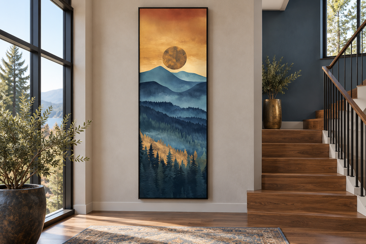 Tall narrow vertical canvas wall art of a mountain sunset with blue peaks and a golden sun.