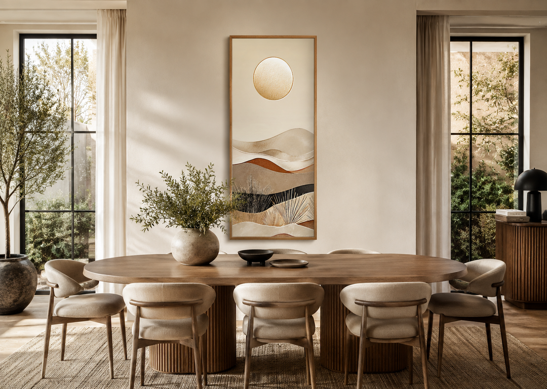 Tall narrow boho desert and sun canvas vertical wall art hanging above a wooden dining table.
