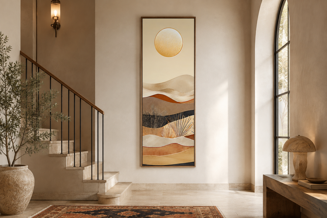 Tall narrow vertical canvas art of a boho desert sun and hills in an earthy neutral entryway.